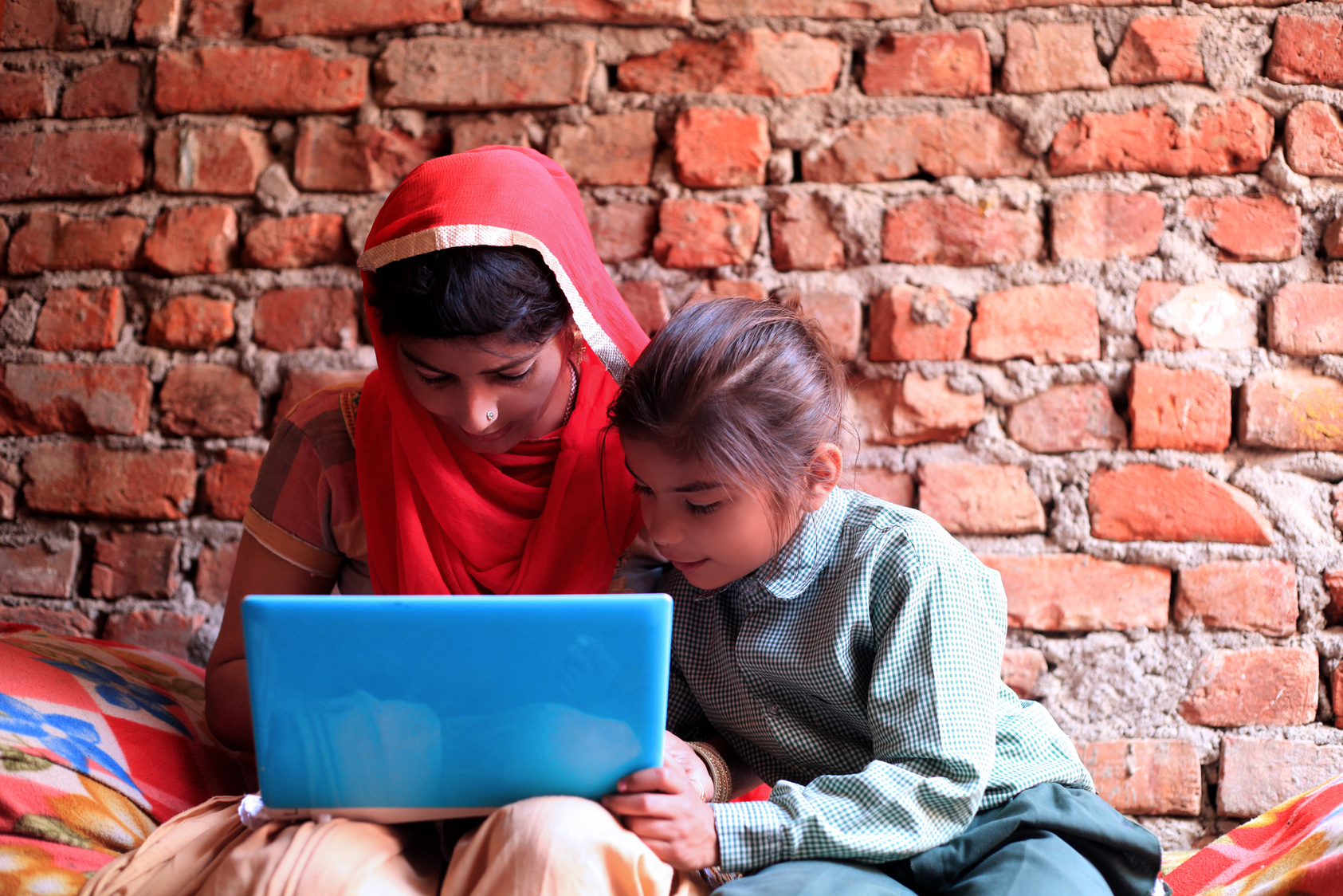 Indian women using laptop at home